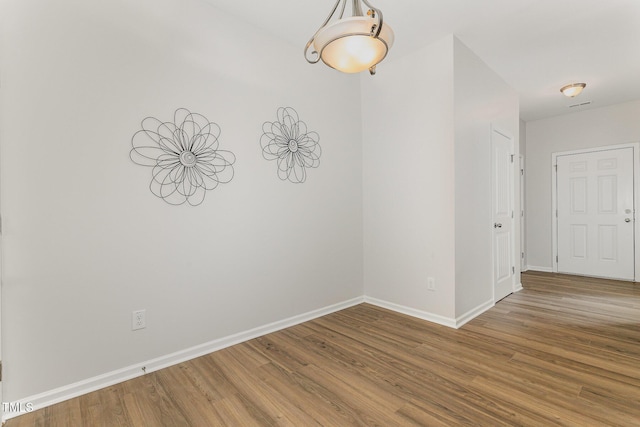 14309 Foxcroft Rd, Raleigh, NC 27614 - unfurnished room with wood finished floors and baseboards