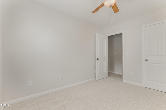 14309 Foxcroft Rd, Raleigh, NC 27614 - unfurnished bedroom featuring light carpet and ceiling fan