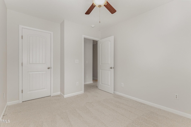 14309 Foxcroft Rd, Raleigh, NC 27614 - unfurnished bedroom with light colored carpet and a ceiling fan