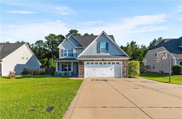 4112 Newgate St, Fayetteville, NC 28306 - craftsman inspired home with stone siding, a porch, driveway, and a garage