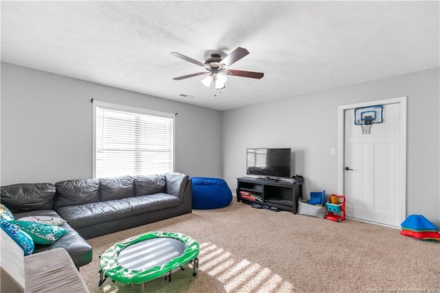 4112 Newgate St, Fayetteville, NC 28306 - carpeted living area featuring ceiling fan and a textured ceiling