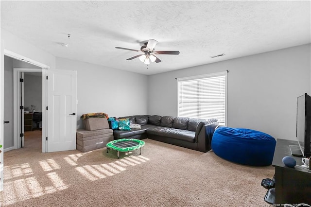 4112 Newgate St, Fayetteville, NC 28306 - carpeted living area with a ceiling fan and a textured ceiling