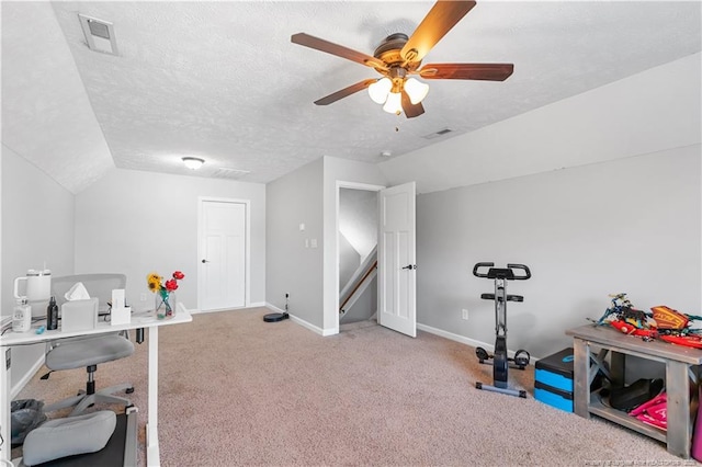 4112 Newgate St, Fayetteville, NC 28306 - exercise area with vaulted ceiling, ceiling fan, carpet flooring, and a textured ceiling