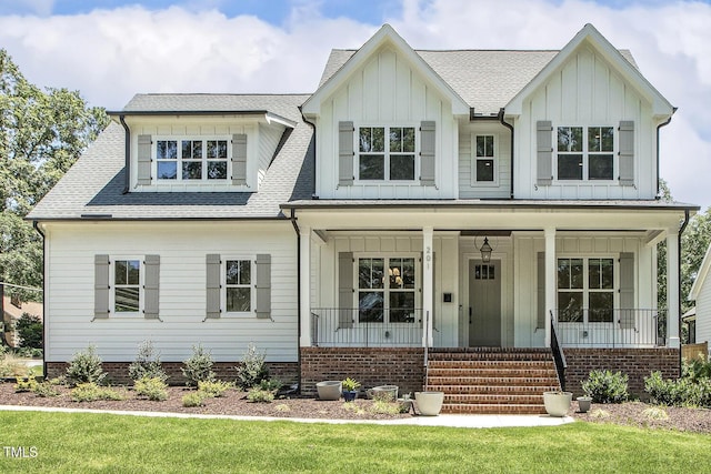 201 S Ennis St, Fuquay Varina, NC 27526 - view of front facade featuring board and batten siding, a porch, and roof with shingles