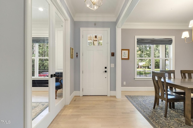 201 S Ennis St, Fuquay Varina, NC 27526 - entryway featuring light wood finished floors, ornamental molding, and a chandelier