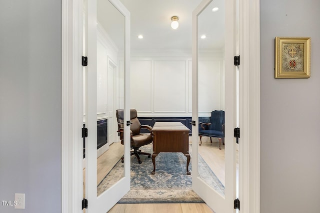 201 S Ennis St, Fuquay Varina, NC 27526 - office area featuring a decorative wall, wood finished floors, recessed lighting, french doors, and crown molding