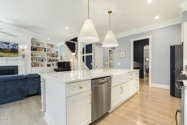 201 S Ennis St, Fuquay Varina, NC 27526 - kitchen featuring stainless steel dishwasher, open floor plan, crown molding, light wood-type flooring, and white cabinets