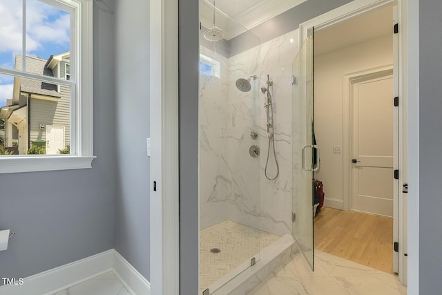 201 S Ennis St, Fuquay Varina, NC 27526 - bathroom with a marble finish shower, marble look tiles, and ornamental molding