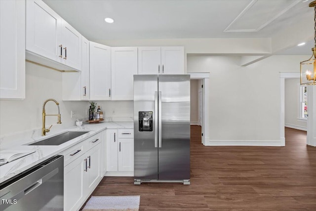 813 N Main St, Burlington, NC 27217 - kitchen featuring appliances with stainless steel finishes, white cabinets, dark wood-type flooring, light stone countertops, and recessed lighting