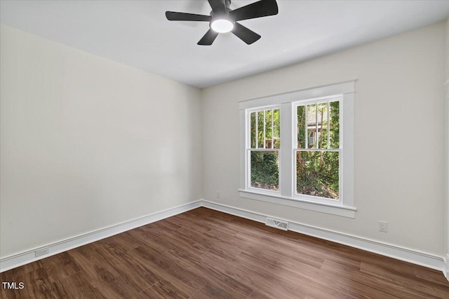 813 N Main St, Burlington, NC 27217 - unfurnished room featuring dark wood finished floors and a ceiling fan