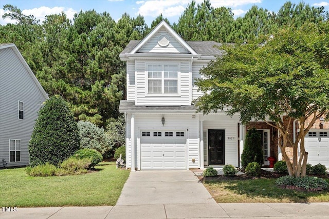 3021 Winding Waters Way, Raleigh, NC 27614 - view of front of house with a front lawn, an attached garage, and driveway