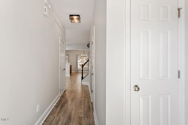 3021 Winding Waters Way, Raleigh, NC 27614 - hallway with an upstairs landing and wood finished floors