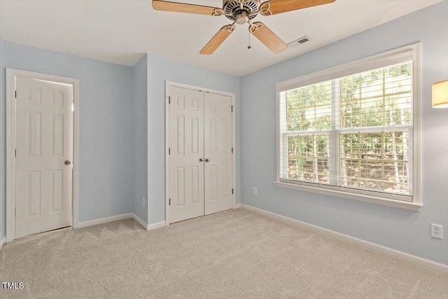 3021 Winding Waters Way, Raleigh, NC 27614 - unfurnished bedroom with carpet flooring, a closet, and a ceiling fan