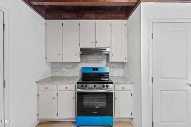 3218 Seven Springs Rd, Hillsborough, NC 27278 - kitchen featuring stainless steel electric range oven, under cabinet range hood, tasteful backsplash, and white cabinetry