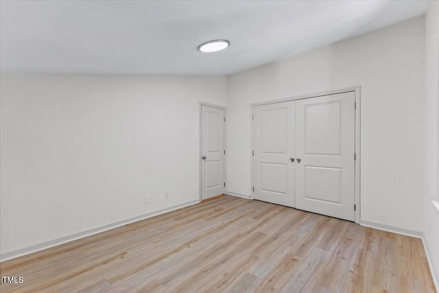 3218 Seven Springs Rd, Hillsborough, NC 27278 - unfurnished bedroom with light wood-style floors and a closet