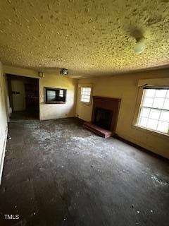 1305 E Jones St, Raleigh, NC 27610 - unfurnished living room with a fireplace with raised hearth