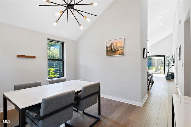 1103 S Bloodworth St, Raleigh, NC 27601 - office with high vaulted ceiling, plenty of natural light, wood finished floors, and a chandelier