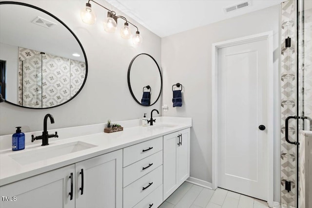 1103 S Bloodworth St, Raleigh, NC 27601 - full bath featuring double vanity, tile patterned flooring, and a stall shower