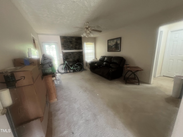 239 Heartwood Dr, Raeford, NC 28376 - living room with light colored carpet, ceiling fan, and a textured ceiling