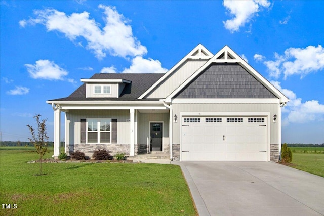 106 Fynloch Chase Dr, Fremont, NC 27830 - craftsman inspired home featuring stone siding, an attached garage, a front yard, driveway, and board and batten siding