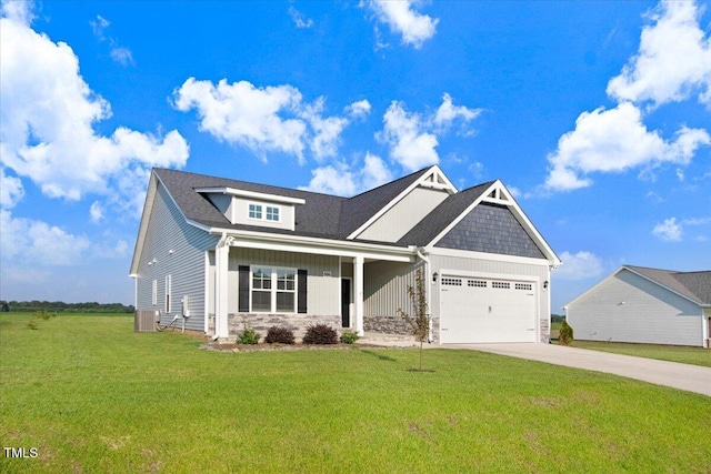 106 Fynloch Chase Dr, Fremont, NC 27830 - craftsman-style home featuring an attached garage, stone siding, driveway, and a front yard