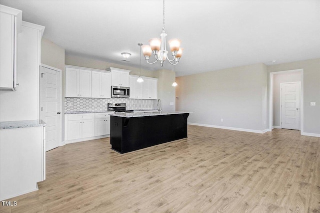 106 Fynloch Chase Dr, Fremont, NC 27830 - kitchen with appliances with stainless steel finishes, a chandelier, tasteful backsplash, white cabinets, and light wood-type flooring