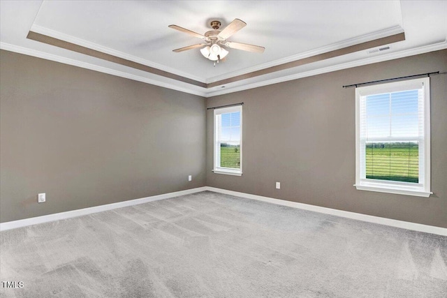 106 Fynloch Chase Dr, Fremont, NC 27830 - empty room with a tray ceiling, crown molding, carpet flooring, and a ceiling fan