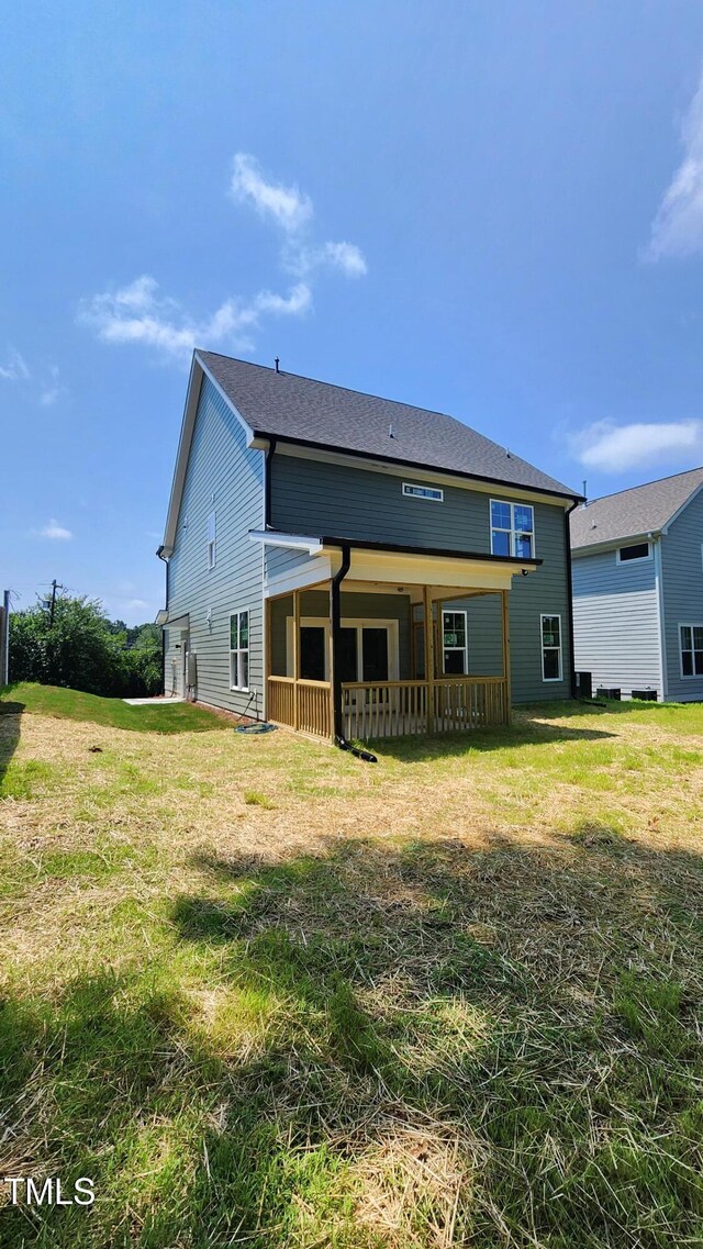 116 Chestnut St, Durham, NC 27707 - rear view of property featuring a yard