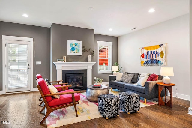 644 Granite Mill Blvd, Chapel Hill, NC 27516 - living room with wood finished floors, recessed lighting, and a glass covered fireplace