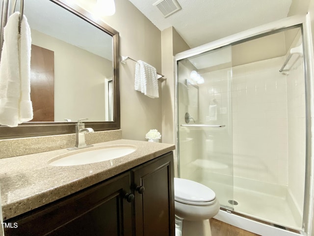4324 Halliwell Dr, Raleigh, NC 27606 - bathroom with vanity, a shower stall, and wood finished floors