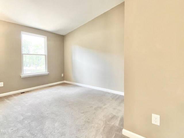 4324 Halliwell Dr, Raleigh, NC 27606 - spare room with lofted ceiling and carpet