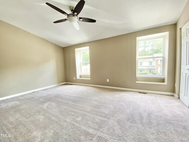 4324 Halliwell Dr, Raleigh, NC 27606 - unfurnished room with a ceiling fan, carpet flooring, and vaulted ceiling