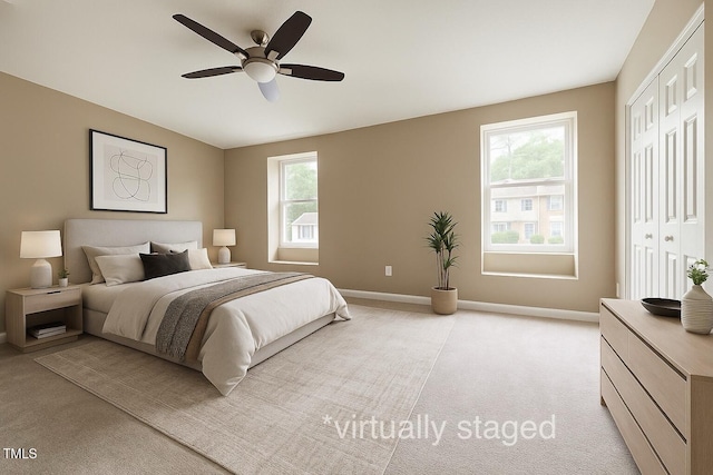 4324 Halliwell Dr, Raleigh, NC 27606 - bedroom featuring light colored carpet, multiple windows, a closet, and a ceiling fan