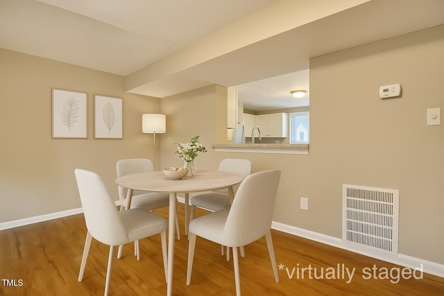 4324 Halliwell Dr, Raleigh, NC 27606 - dining space with wood finished floors