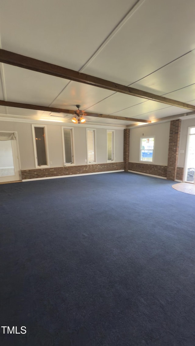 501 Morgan Ter, Burlington, NC 27217 - unfurnished room with carpet, brick wall, beam ceiling, and ceiling fan