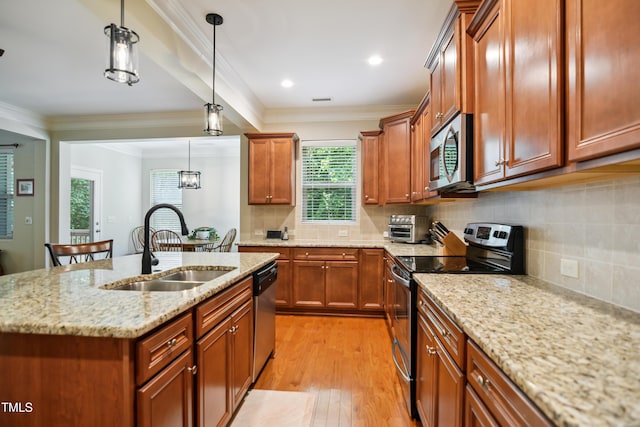 733 Bluffcreek Dr, Fuquay Varina, NC 27526 - kitchen featuring stainless steel appliances, light wood-type flooring, pendant lighting, light stone countertops, and brown cabinetry