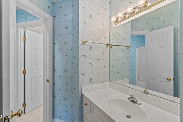 3556 Iris St, Wilmington, NC 28409 - bathroom with wallpapered walls, vanity, and tile patterned flooring