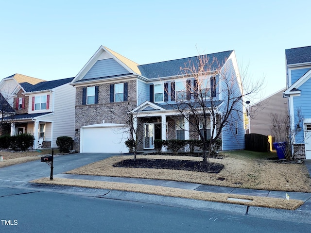 302 Glenview Ln, Durham, NC 27703 - traditional-style house featuring driveway, an attached garage, and brick siding