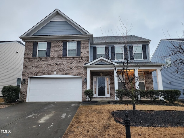 302 Glenview Ln, Durham, NC 27703 - view of front facade featuring brick siding, concrete driveway, and an attached garage