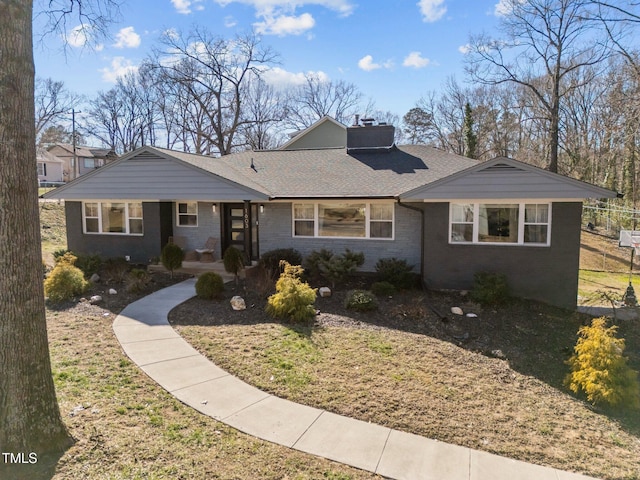 1603 N Alston Ave, Durham, NC 27701 - view of front of property featuring a chimney, brick siding, roof with shingles, and a front yard