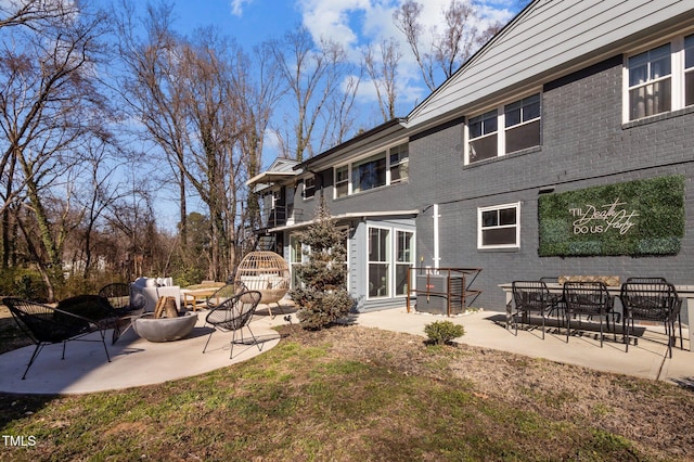 1603 N Alston Ave, Durham, NC 27701 - rear view of property with brick siding and a patio area