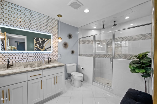 1603 N Alston Ave, Durham, NC 27701 - bathroom with double vanity, a stall shower, recessed lighting, tile patterned floors, and decorative backsplash