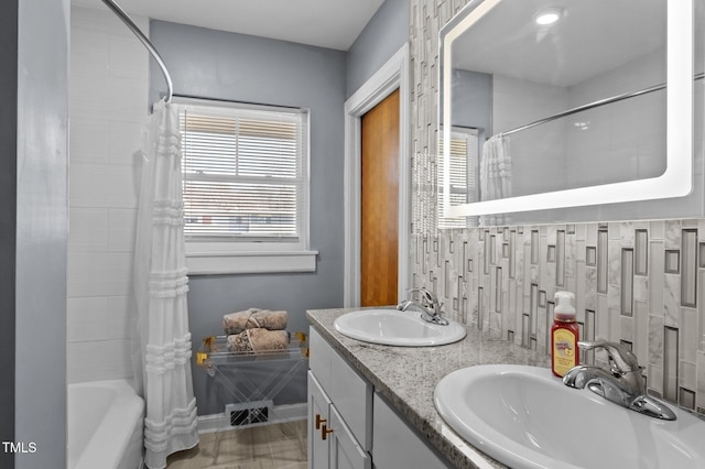 1603 N Alston Ave, Durham, NC 27701 - bathroom with shower / tub combo, double vanity, and tasteful backsplash