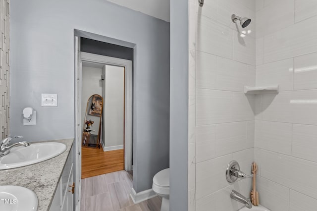 1603 N Alston Ave, Durham, NC 27701 - full bathroom featuring double vanity, shower / washtub combination, and wood finished floors