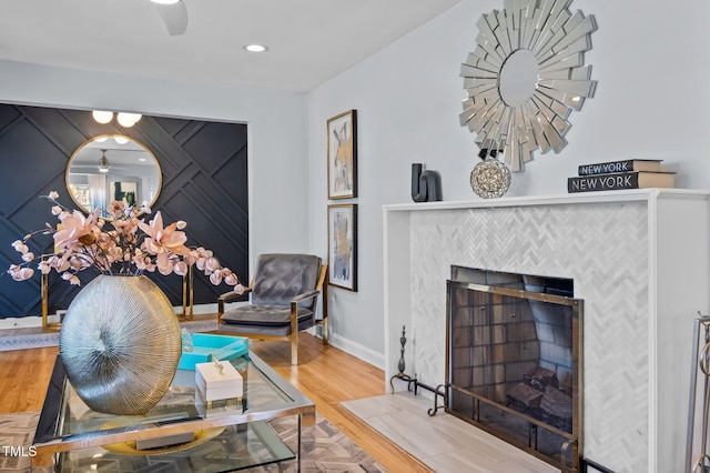 1603 N Alston Ave, Durham, NC 27701 - sitting room with a tiled fireplace, wood finished floors, ceiling fan, and recessed lighting
