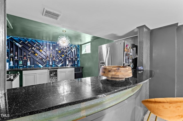 1603 N Alston Ave, Durham, NC 27701 - indoor bar with stainless steel fridge with ice dispenser, wine cooler, and a chandelier