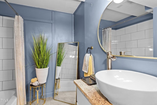 1603 N Alston Ave, Durham, NC 27701 - bathroom featuring tile patterned flooring, vanity, and shower / tub combo