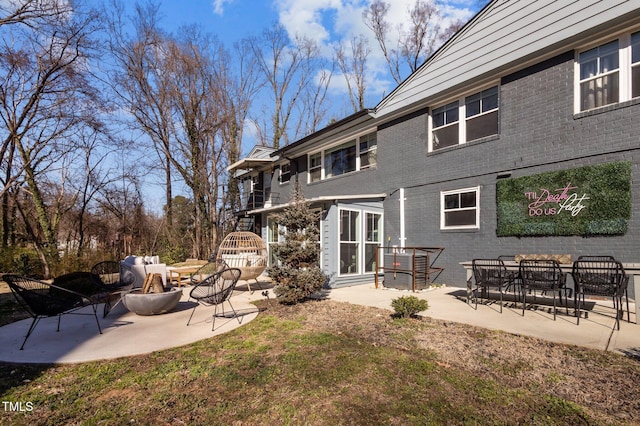 1603 N Alston Ave, Durham, NC 27701 - rear view of property featuring brick siding and a patio