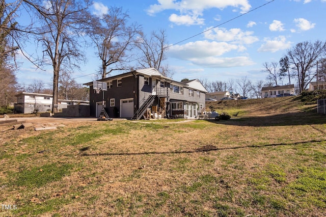 1603 N Alston Ave, Durham, NC 27701 - rear view of property with an attached garage, a lawn, stairway, and driveway