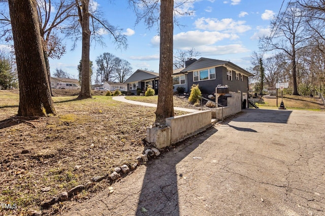 1603 N Alston Ave, Durham, NC 27701 - view of front of home with driveway and a chimney
